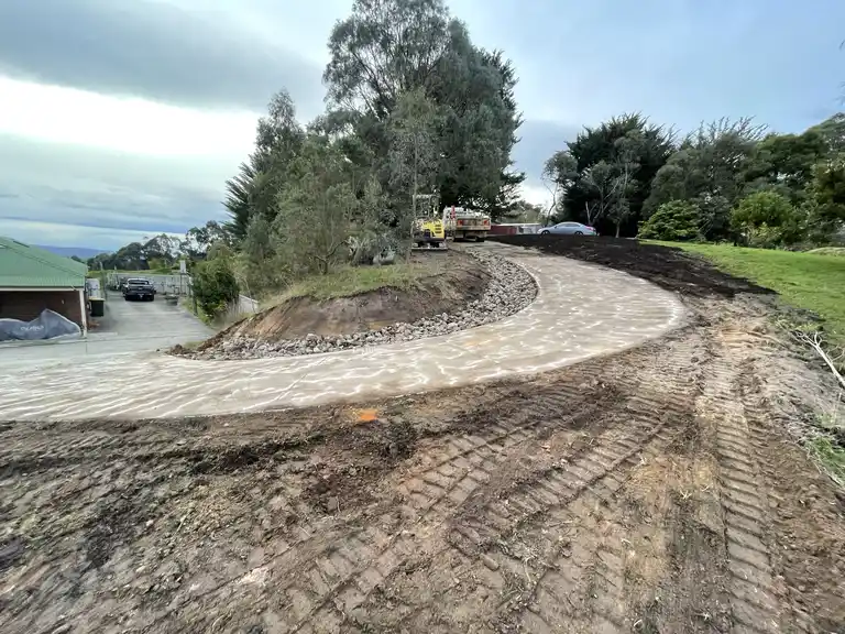 Curved concrete driveway preparation and leveling on a large Gippsland property